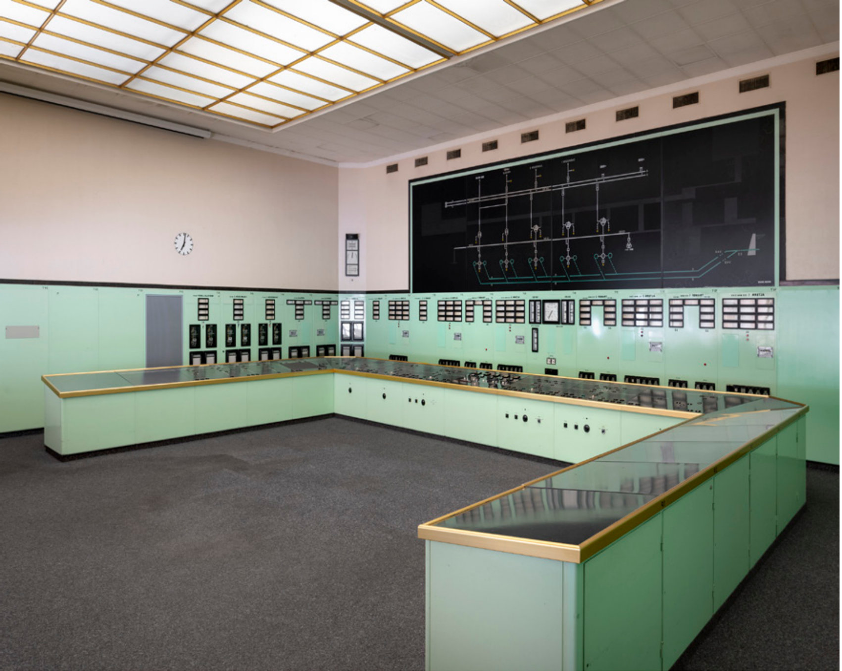 Control room with mint-green consoles