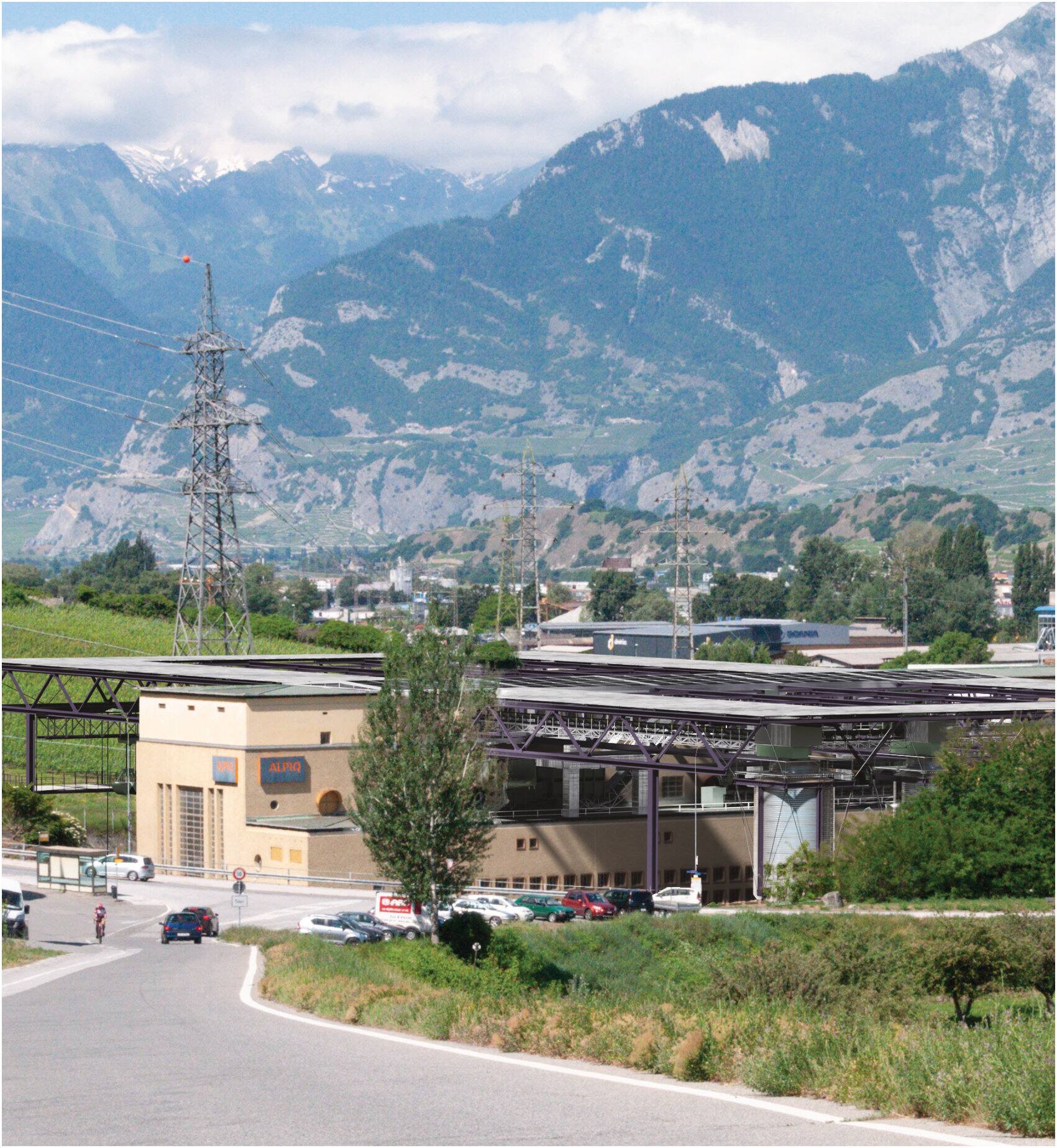 The plant with its new industrial cloak in front of the Valais mountains
