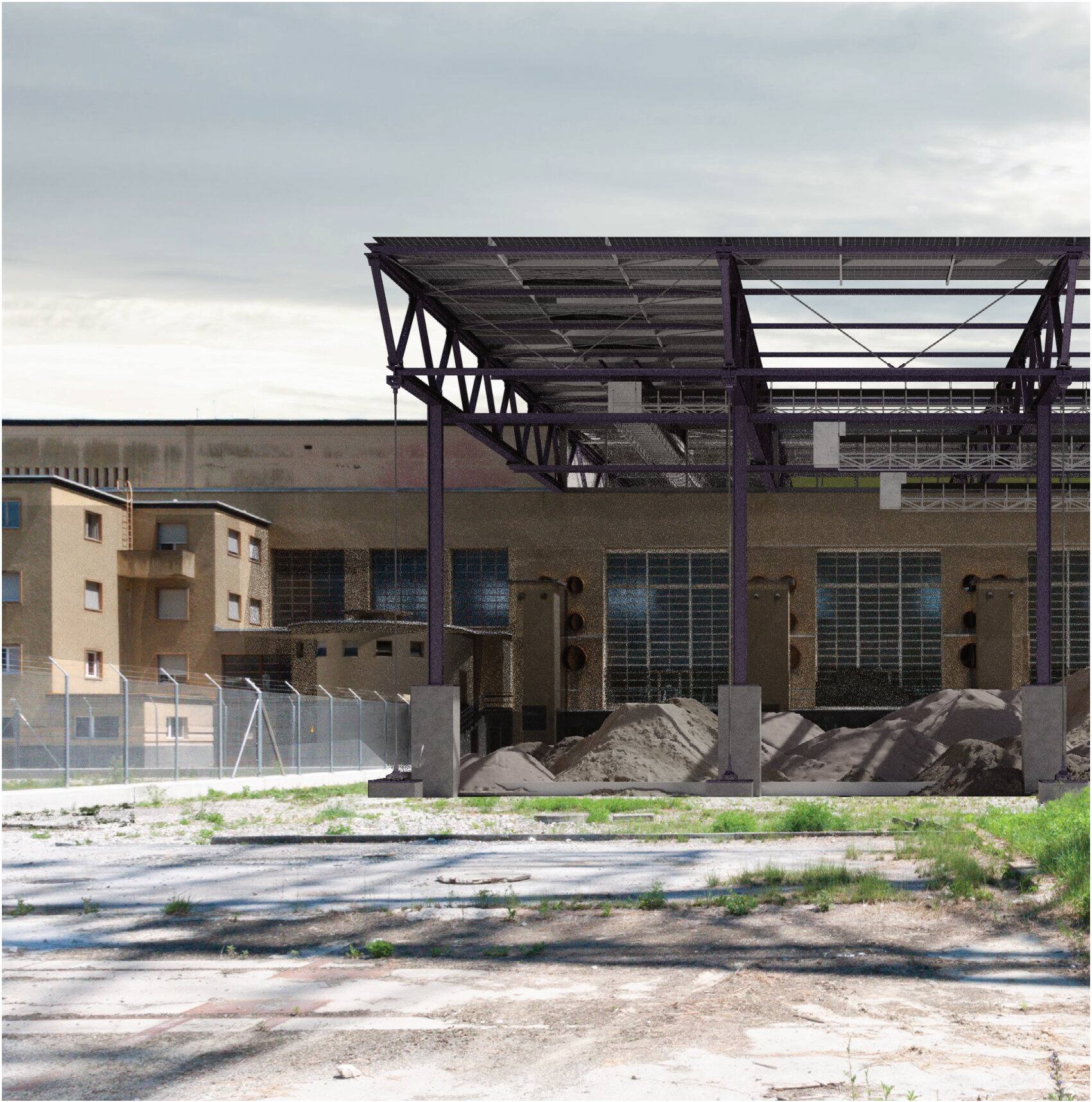 Steel structure over gravel heaps in front of the plant